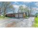 Charming single-story brick home with attached two car garage and a long driveway at 7825 N County Road 650 E, Brownsburg, IN 46112