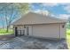 Detached garage featuring neutral siding, lighting fixtures, and a gated entry at 7825 N County Road 650 E, Brownsburg, IN 46112
