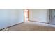Bright living room with neutral carpet and an entry door at 7825 N County Road 650 E, Brownsburg, IN 46112