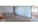 Spacious living room with neutral carpet and view into adjacent room at 7825 N County Road 650 E, Brownsburg, IN 46112