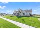 Attractive home featuring a lush green lawn and a welcoming front entrance at 8083 Easton Ln, Zionsville, IN 46077