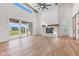 Bright living room featuring hardwood floors, fireplace and sliding doors to outside at 8083 Easton Ln, Zionsville, IN 46077