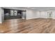 Finished basement with wood grain floors, modern lighting, and plenty of natural light at 8083 Easton Ln, Zionsville, IN 46077