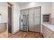 Kitchen with gray cabinets, stainless refrigerator, and doorway to living space at 8083 Easton Ln, Zionsville, IN 46077