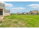 Large backyard featuring green grass and a view of neighboring homes in the community at 8083 Easton Ln, Zionsville, IN 46077