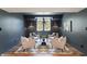 Finished basement sitting area with dark gray walls, recessed lighting, and modern furniture at 8083 Easton Ln, Zionsville, IN 46077