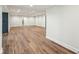Large open basement space with hardwood flooring and recessed lighting throughout at 8083 Easton Ln, Zionsville, IN 46077