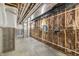 Unfinished basement featuring insulated walls, concrete floor, and exposed ceiling pipes at 8083 Easton Ln, Zionsville, IN 46077