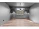 Basement rec room with industrial pendant lighting and a view of window wells at 8083 Easton Ln, Zionsville, IN 46077