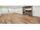 Finished basement boasts hardwood floors and a bar area with custom cabinets and a wine fridge at 8083 Easton Ln, Zionsville, IN 46077
