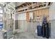 Utility area features the furnace, water heater, and water filtration system, ready for use at 8083 Easton Ln, Zionsville, IN 46077