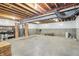 Unfinished basement with exposed ceiling, concrete foundation, and open space for storage at 8083 Easton Ln, Zionsville, IN 46077