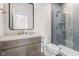 Bathroom featuring tiled glass shower, modern vanity, and a sleek framed mirror at 8083 Easton Ln, Zionsville, IN 46077