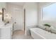 Luxurious bathroom featuring a freestanding tub and elegant fixtures at 8083 Easton Ln, Zionsville, IN 46077
