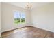 Bedroom with hardwood floors and large window with a view at 8083 Easton Ln, Zionsville, IN 46077