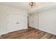 Bedroom with hardwood floors, double closet with white doors, and a ceiling fan at 8083 Easton Ln, Zionsville, IN 46077