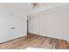Bedroom showcasing hardwood flooring, double door closets, and neutral walls at 8083 Easton Ln, Zionsville, IN 46077