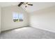 Bedroom with vaulted ceiling, ceiling fan, and a large window at 8083 Easton Ln, Zionsville, IN 46077