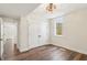 Spacious bedroom featuring hardwood floors, double closet with white doors, and a ceiling fan at 8083 Easton Ln, Zionsville, IN 46077