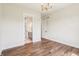 Bedroom with hardwood floors, chandelier and ensuite bathroom at 8083 Easton Ln, Zionsville, IN 46077