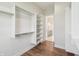Spacious walk-in closet with custom storage, shelving, and drawers at 8083 Easton Ln, Zionsville, IN 46077