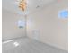 Bright bedroom with neutral walls, carpet, modern lighting fixture, and several windows at 8083 Easton Ln, Zionsville, IN 46077