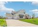 Wide driveway leads to this new home with three-car garage and verdant lawn at 8083 Easton Ln, Zionsville, IN 46077