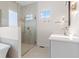 Bright bathroom features a glass-enclosed shower and a modern vanity at 8083 Easton Ln, Zionsville, IN 46077