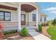 Inviting covered porch and walkway lead up to a lovely wood and glass door at 8083 Easton Ln, Zionsville, IN 46077