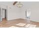 Spacious main bedroom boasts hardwood floors, a modern chandelier, and an en suite bathroom at 8083 Easton Ln, Zionsville, IN 46077