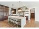 Modern kitchen with a large island, marble countertops, and stainless steel appliances at 8083 Easton Ln, Zionsville, IN 46077