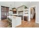Spacious kitchen features a large island, stainless steel appliances, and ample cabinet space at 8083 Easton Ln, Zionsville, IN 46077
