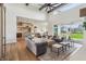 Open-concept living room with hardwood floors, modern fixtures, and ample seating at 8083 Easton Ln, Zionsville, IN 46077