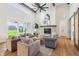 Spacious living room with high ceilings, a fireplace, and sliding doors to the yard at 8083 Easton Ln, Zionsville, IN 46077
