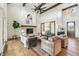 Bright and airy living room with fireplace, hardwood floors, and cozy seating area at 8083 Easton Ln, Zionsville, IN 46077