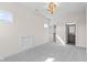 A bedroom featuring neutral walls, carpet, modern lighting, and an attached bathroom at 8083 Easton Ln, Zionsville, IN 46077