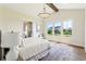 Bright main bedroom with vaulted ceiling, chandelier, and abundant natural light at 8083 Easton Ln, Zionsville, IN 46077