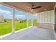 Covered patio boasts brick accents, a ceiling fan, and expansive views of the community at 8083 Easton Ln, Zionsville, IN 46077