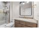 Bathroom featuring modern fixtures, vanity, and walk-in shower at 8083 Easton Ln, Zionsville, IN 46077