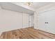 Bedroom with wood-look floors and ample closet space at 8083 Easton Ln, Zionsville, IN 46077
