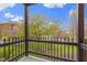 Scenic balcony view overlooking a well-maintained green space with mature trees at 8651 Jaffa Court East Dr # 18, Indianapolis, IN 46260