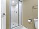Modern bathroom with a tiled glass-enclosed shower and a neutral color scheme at 8651 Jaffa Court East Dr # 18, Indianapolis, IN 46260