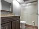 Modern bathroom with glass shower, stone flooring, and vanity sink at 8651 Jaffa Court East Dr # 18, Indianapolis, IN 46260