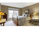 Cozy bedroom with a queen-sized bed, large window and neutral decor at 8651 Jaffa Court East Dr # 18, Indianapolis, IN 46260
