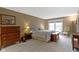 Spacious bedroom with a window, hardwood floor and walk-in closet at 8651 Jaffa Court East Dr # 18, Indianapolis, IN 46260