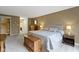 Bright bedroom showcasing a stylish bed, hardwood floors and elegant furniture at 8651 Jaffa Court East Dr # 18, Indianapolis, IN 46260