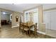Comfortable dining area with hardwood floors, a wooden table, and neutral-colored walls at 8651 Jaffa Court East Dr # 18, Indianapolis, IN 46260
