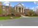 An eye-level front exterior shows the brick building's symmetrical design and manicured lawn at 8651 Jaffa Court East Dr # 18, Indianapolis, IN 46260