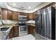 Contemporary kitchen featuring stainless steel appliances, granite counters, and ample cabinet space at 8651 Jaffa Court East Dr # 18, Indianapolis, IN 46260