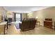 Comfortable living room with a fireplace, sliding door to the deck and neutral-toned decor at 8651 Jaffa Court East Dr # 18, Indianapolis, IN 46260